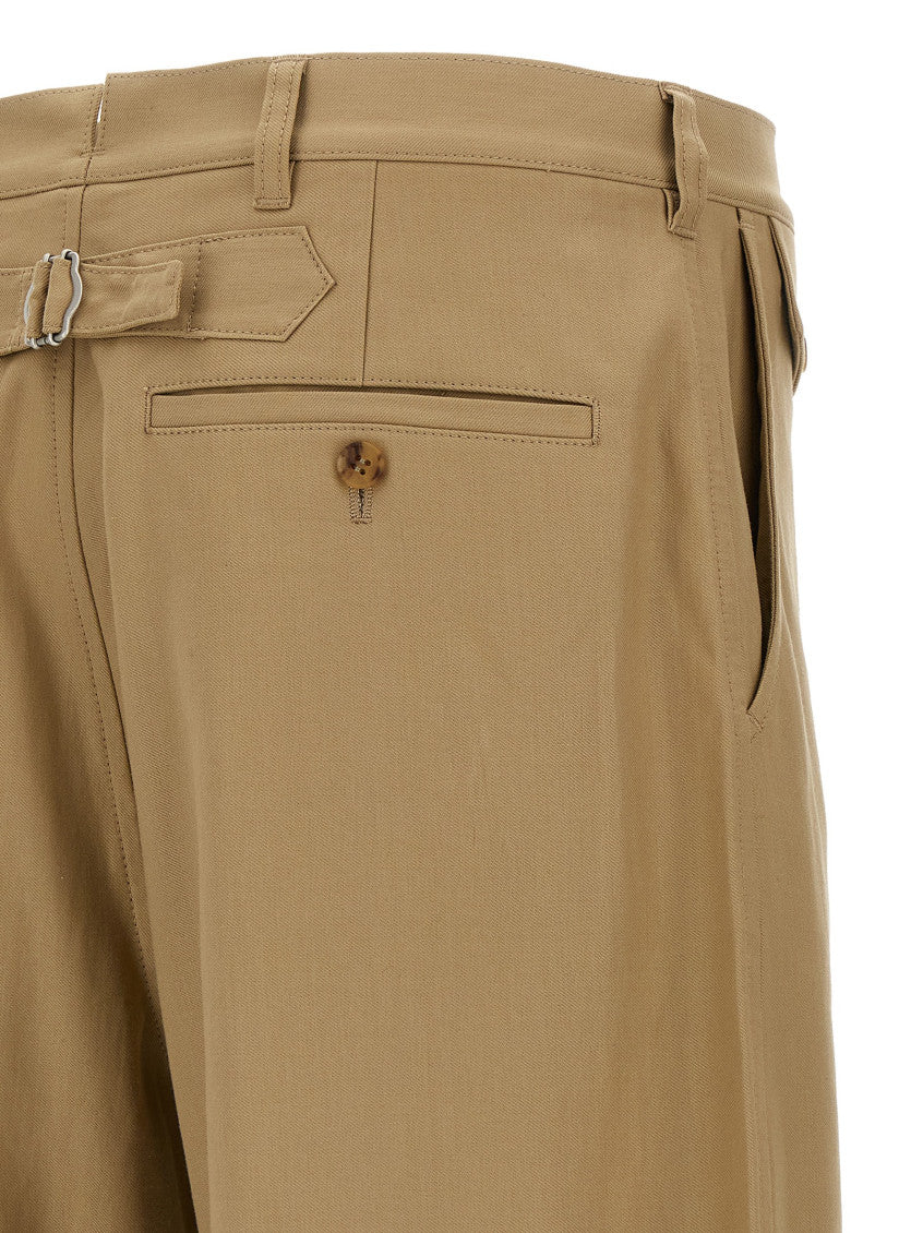 Beige Curved leg pants 4